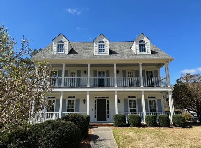 After siding, window, column, deck, waterproofing, and exterior painting project in Marietta